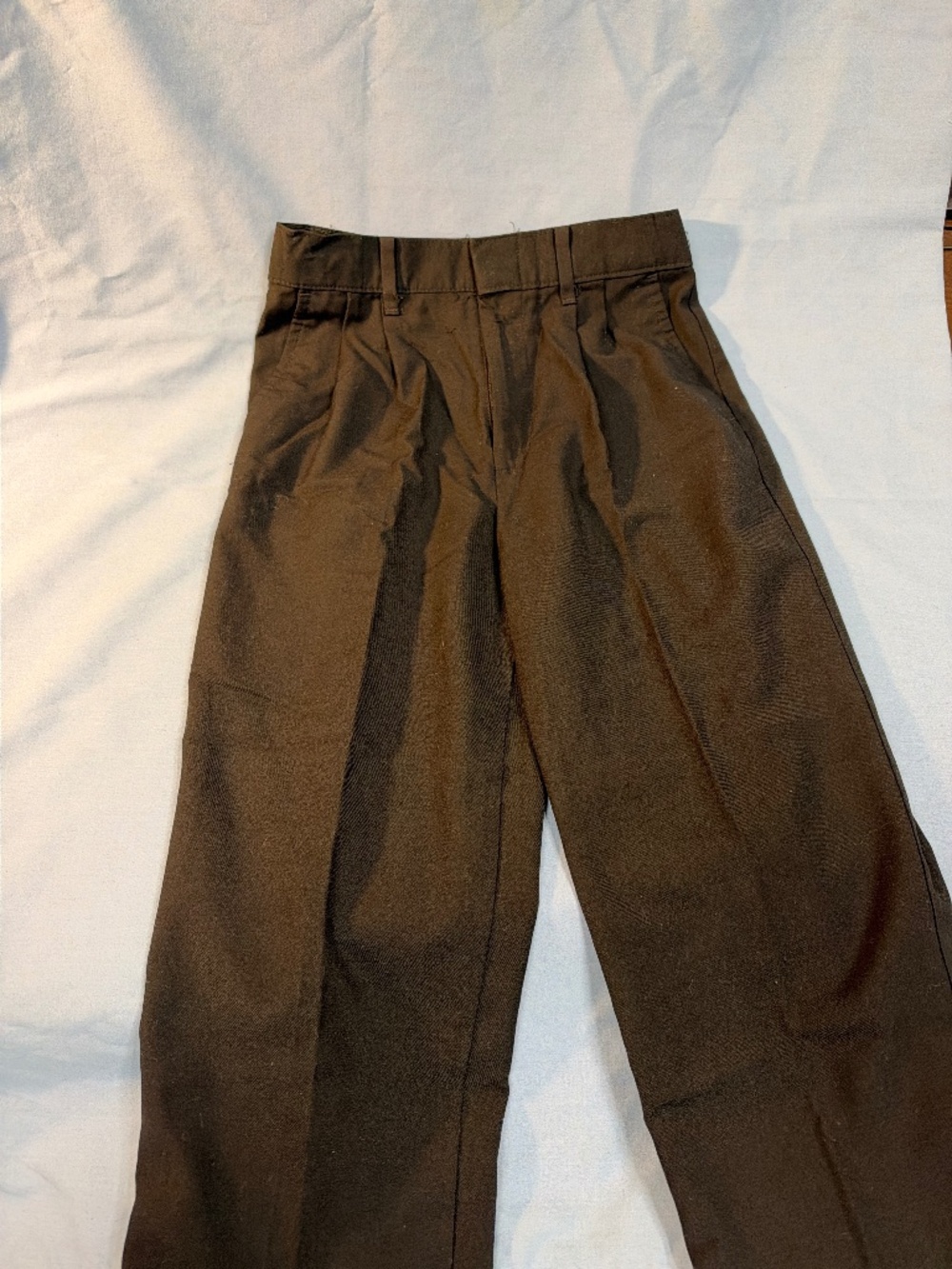 Dockers kid size 7 pleated black pants with expansion waistline.